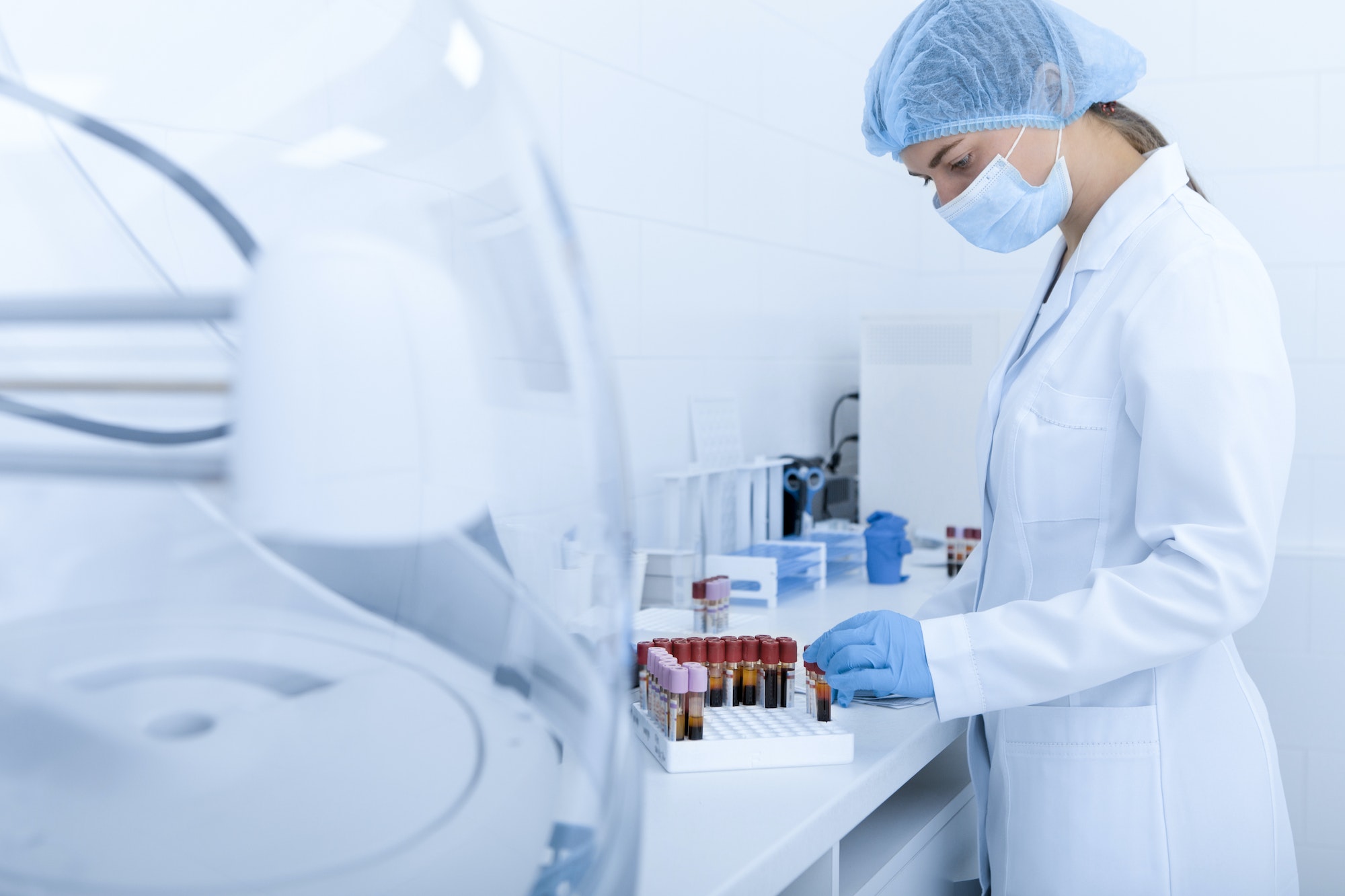 Woman collecting blood samples for testing on different diseases